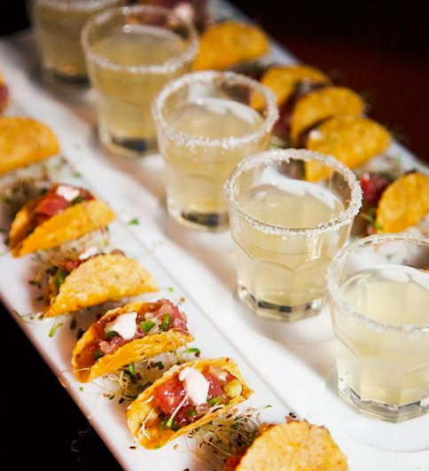 cool wedding food ideas, mini tacos and shots of tequila